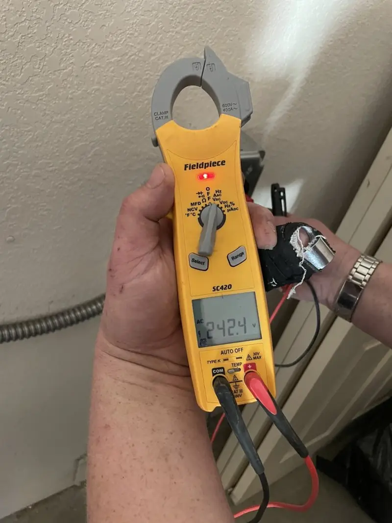 Voltage testing with clamp meter during Generator Installation in Woodland Park